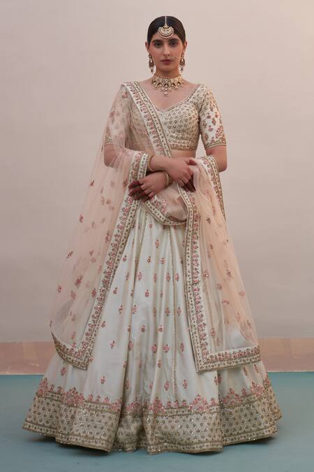 Angad Singh_Ivory Silk Sequins, Cut Work Floral Embroidered Raw Bridal Lehenga Set _at_Aza_Fashions