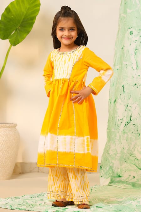 Buy Cute Couture Yellow , Chanderi Shibori Placement Print Anarkali And Sharara Set at Aza Fashions Buy_Cute Couture_Yellow , Chanderi Shibori Placement Print Anarkali And Sharara Set _at_Aza_Fashions