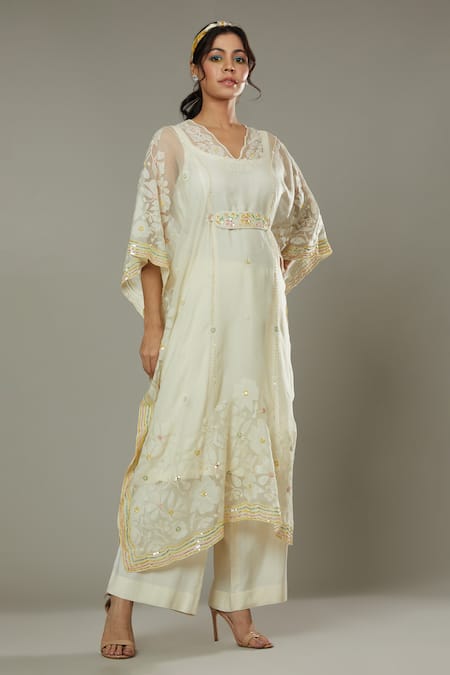 Shop I Am Design Ivory Silk Organza Floral Appliques, Sequins French Vanilla Kaftan And Pant Set at Aza Fashions Shop_I Am Design_Ivory Silk Organza Floral Appliques, Sequins French Vanilla Kaftan And Pant Set _at_Aza_Fashions