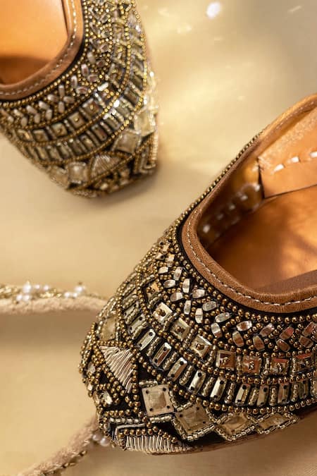 Shop_Kurrbat_Black Embroidered Regal Stone And Zardozi Juttis _at_Aza_Fashions