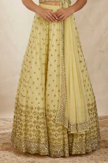 ASTHA NARANG_Yellow Net, Crepe, Nylon Embroidery, Cut Work, Flower Bridal Lehenga Set _Online_at_Aza_Fashions