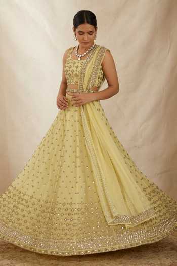Shop_ASTHA NARANG_Yellow Net, Crepe, Nylon Embroidery, Cut Work, Flower Bridal Lehenga Set _Online_at_Aza_Fashions