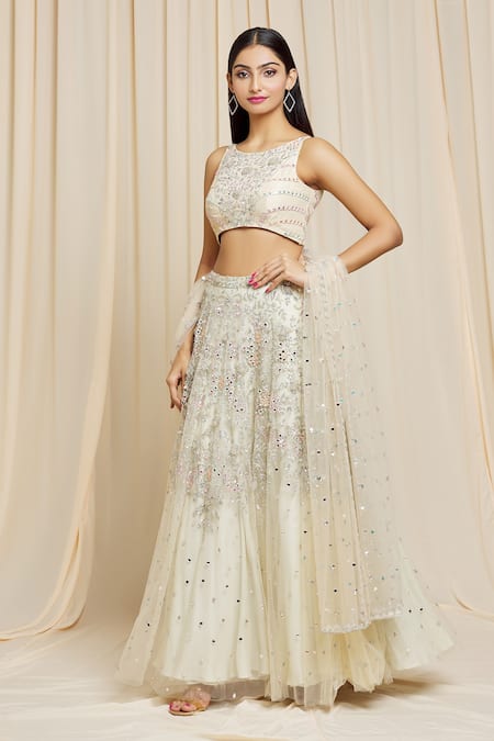 Izzumi Mehta Ivory Net Floral Round Hand Embroidered Lehenga Choli Set at Aza Fashions Izzumi Mehta_Ivory Net Floral Round Hand Embroidered Lehenga Choli Set _at_Aza_Fashions