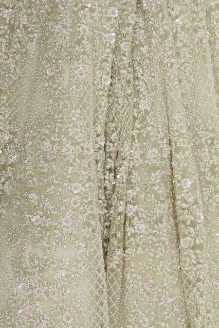 COUTURE BY NIHARIKA_White Net Beads V Neck Ruffle Detail Lehenga With Blouse _at_Aza_Fashions