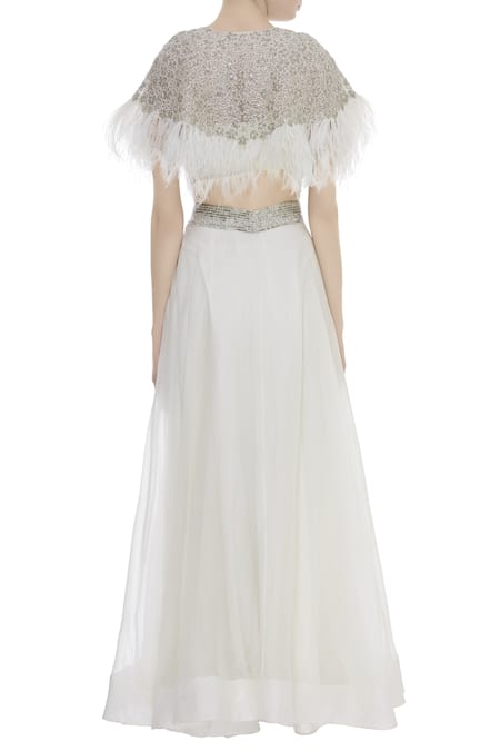 Shop COUTURE BY NIHARIKA White Organza Floral Round Neck Feather Detail Cape Blouse With Lehenga Skirt at Aza Fashions Shop_COUTURE BY NIHARIKA_White Organza Floral Round Neck Feather Detail Cape Blouse With Lehenga Skirt _at_Aza_Fashions