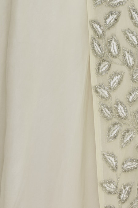 COUTURE BY NIHARIKA Cream Organza, Net Leaf Boat Neck Embroidered Lehenga With Blouse And Jacket at Aza Fashions COUTURE BY NIHARIKA_Cream Organza, Net Leaf Boat Neck Embroidered Lehenga With Blouse And Jacket _at_Aza_Fashions