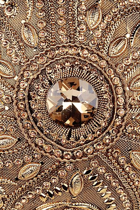 Shop Puneet Gupta Gold Stones Carved Tassel Detail Clutch Online at Aza Fashions Shop_Puneet Gupta_Gold Stones Carved Tassel Detail Clutch_Online_at_Aza_Fashions