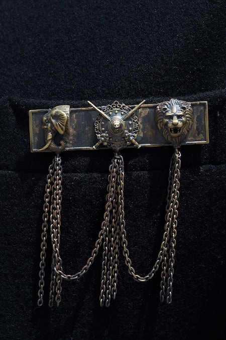Shop Cosa Nostraa Gold Metal Maharaja Brooch With Chain Tassels at Aza Fashions Shop_Cosa Nostraa_Gold Metal Maharaja Brooch With Chain Tassels_at_Aza_Fashions
