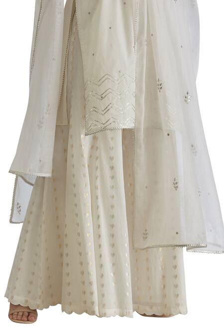 Shop_MANDIRA WIRK - Indian_Off White Textured Cotton Panelled Sharara Pants _Online_at_Aza_Fashions