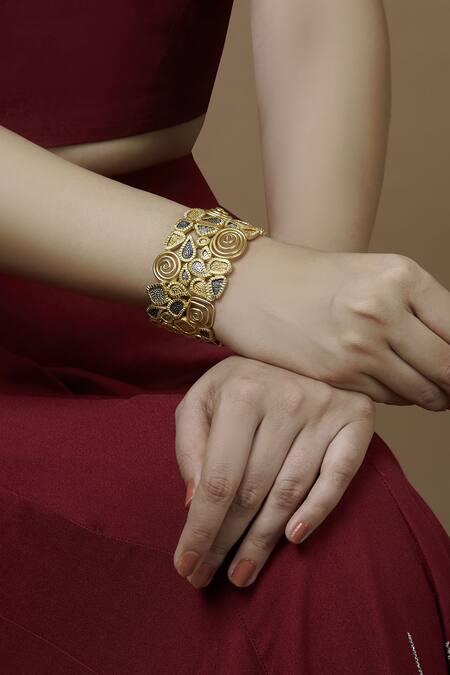 Buy Mira By Radhika Jain Gold Plated Metal Carved Handcuff Online at Aza Fashions Buy_Mira By Radhika Jain_Gold Plated Metal Carved Handcuff_Online_at_Aza_Fashions