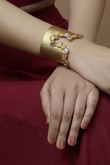 Buy_Mira By Radhika Jain_Gold Plated Stones Carved Handcuff _Online_at_Aza_Fashions
