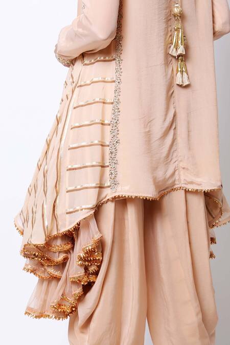 Shop Nikasha Beige Round Asymmetric Kurta Dhoti Pant Set Online at Aza Fashions Shop_Nikasha_Beige Round Asymmetric Kurta Dhoti Pant Set _Online_at_Aza_Fashions