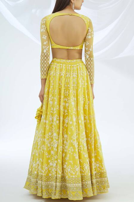 ASTHA NARANG_Yellow Net, Crepe Leaf Neck Embroidered Lehenga Set_Online_at_Aza_Fashions
