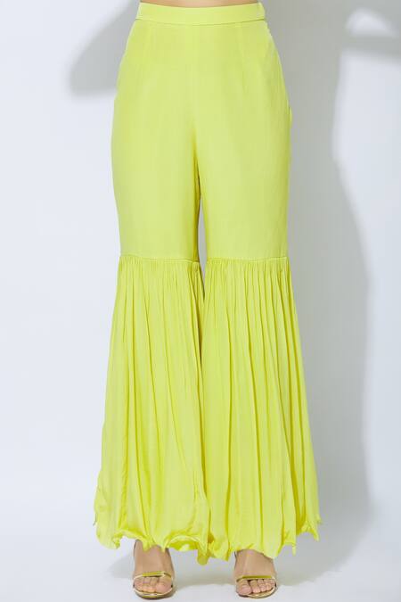 Buy_NIDHIKA SHEKHAR_Yellow Crepe, Georgette, Shantoon Lining V-shaped Asymmetric Kurta Sharara Set _Online_at_Aza_Fashions