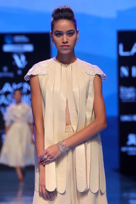 Shop Archana Rao Cream Faux Leather Round Fringed Top at Aza Fashions Shop_Archana Rao_Cream Faux Leather Round Fringed Top _at_Aza_Fashions