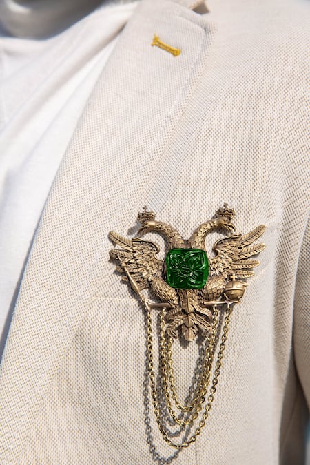 Shop Cosa Nostraa Gold Stone, Metal Antique Carved Phoenix Tassel Brooch at Aza Fashions Shop_Cosa Nostraa_Gold Stone, Metal Antique Carved Phoenix Tassel Brooch _at_Aza_Fashions