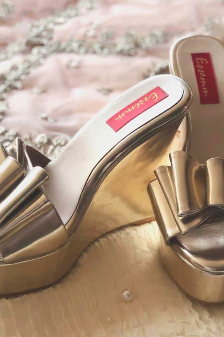 Shop Essemm Gold Metallic Bow Wedges at Aza Fashions Shop_Essemm_Gold Metallic Bow Wedges _at_Aza_Fashions