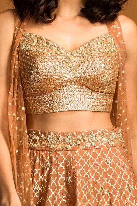Buy Izzumi Mehta Gold Blouse And Lehenga Chanderi Jacket Net Zardozi Embroidered Set Online at Aza Fashions Buy_Izzumi Mehta_Gold Blouse And Lehenga Chanderi Jacket Net Zardozi Embroidered Set _Online_at_Aza_Fashions