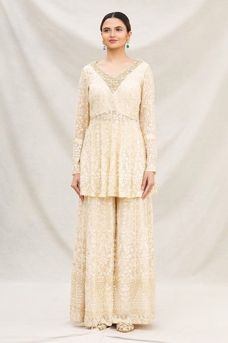 Shop Neha Mehta Couture Gold Georgette V Neck Peplum Kurta And Gharara Set Online at Aza Fashions Shop_Neha Mehta Couture_Gold Georgette V Neck Peplum Kurta And Gharara Set _Online_at_Aza_Fashions