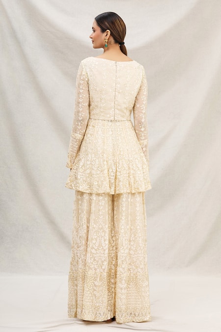 Shop Neha Mehta Couture Gold Georgette V Neck Peplum Kurta And Gharara Set at Aza Fashions Shop_Neha Mehta Couture_Gold Georgette V Neck Peplum Kurta And Gharara Set _at_Aza_Fashions