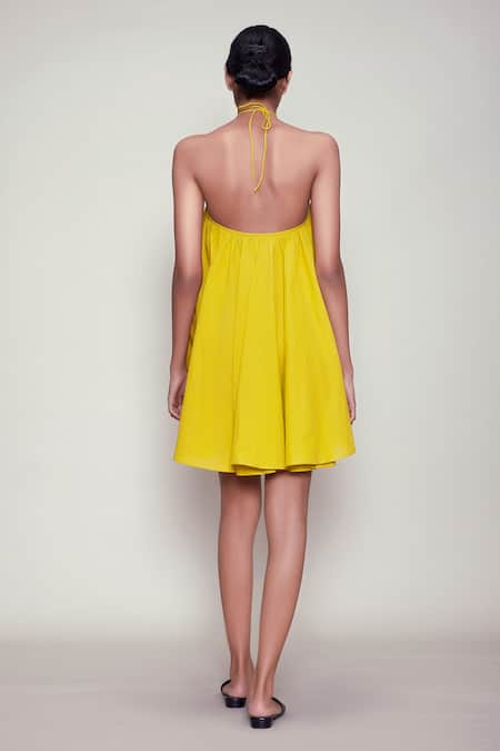 Shop MATI_1 Yellow Cotton Halter Backless Dress at Aza Fashions Shop_MATI_1_Yellow Cotton Halter Backless Dress _at_Aza_Fashions