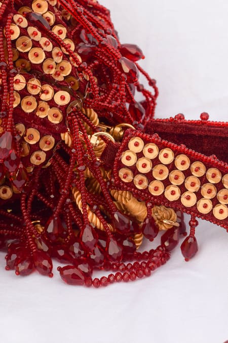 Shop Eena Red Embroidery, Beads, Sequins Shayna Tassel Potli Bag at Aza Fashions Shop_Eena_Red Embroidery, Beads, Sequins Shayna Tassel Potli Bag _at_Aza_Fashions