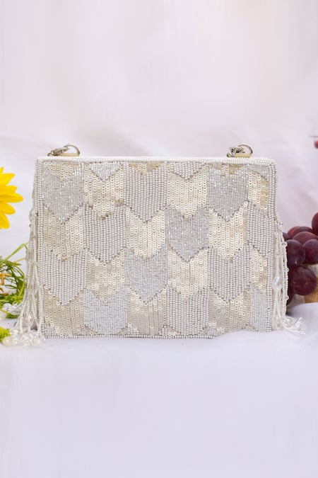 Shop Eena White Embroidered Dishi Tassel Clutch With Sling at Aza Fashions Shop_Eena_White Embroidered Dishi Tassel Clutch With Sling _at_Aza_Fashions