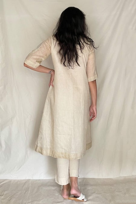 Shop Chambray & CO. White Cotton, Chanderi With Zari Stripes Round Embroidered Tunic at Aza Fashions Shop_Chambray & CO._White Cotton, Chanderi With Zari Stripes Round Embroidered Tunic _at_Aza_Fashions