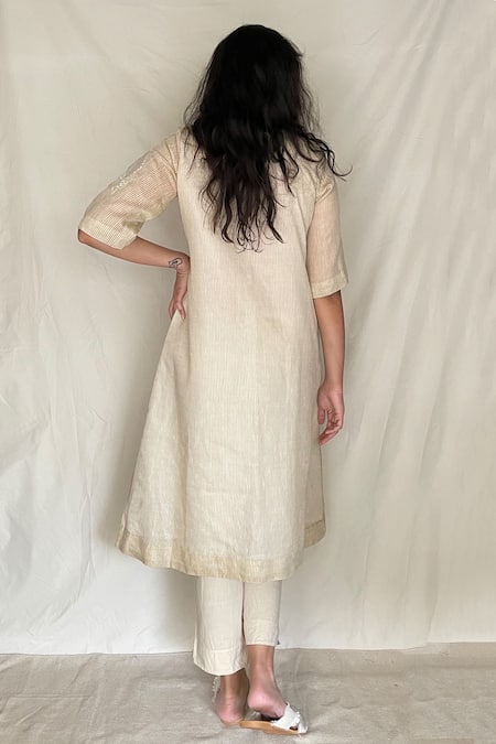 Shop Chambray & CO. White Cotton, Chanderi With Zari Stripes Round Embroidered Tunic Pants at Aza Fashions Shop_Chambray & CO._White Cotton, Chanderi With Zari Stripes Round Embroidered Tunic Pants _at_Aza_Fashions