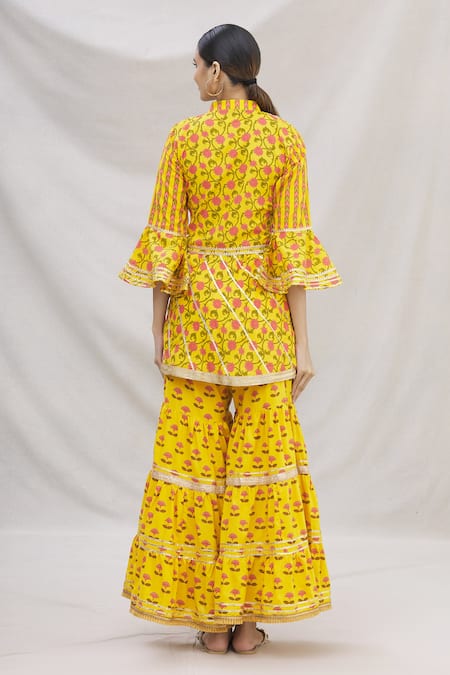 Shop Kunwarani Ritu Yellow Cotton Mandarin Collar Floral Motif Peplum Kurta Set at Aza Fashions Shop_Kunwarani Ritu_Yellow Cotton Mandarin Collar Floral Motif Peplum Kurta Set _at_Aza_Fashions