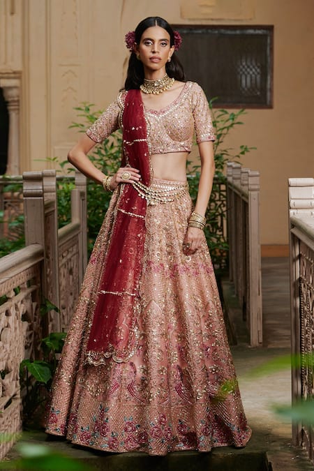 Bridal lehenga paired with pink color heavily embellished choli and net  heavy embroidered border in peach and maroon color. |lovelyweddingmall.com|