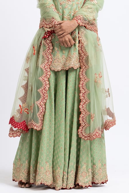 Nitika Gujral_Green Net, Georgette Floral Sweetheart Neck Embroidered Kurta Sharara Set _at_Aza_Fashions