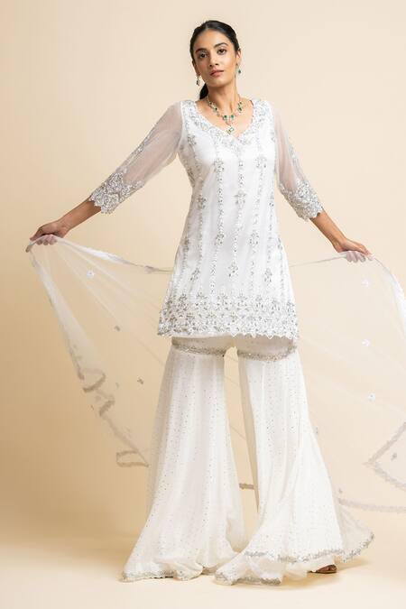 Nitika Gujral_White Georgette Embroidered Mukaish V Neck Kurta Gharara Set _Online_at_Aza_Fashions