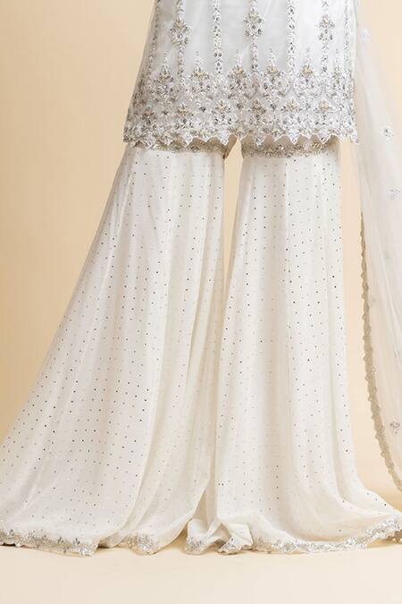 Nitika Gujral_White Georgette Embroidered Mukaish V Neck Kurta Gharara Set _at_Aza_Fashions