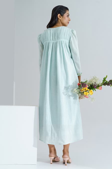 Shop The Right Cut Blue Cotton Mul Floral Motifs Round Aqua Marine Handloom Dress at Aza Fashions Shop_The Right Cut_Blue Cotton Mul Floral Motifs Round Aqua Marine Handloom Dress _at_Aza_Fashions