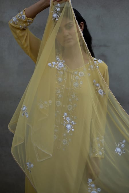 Shop Radha Sharma Yellow Georgette Embroidered Floral Motifs Leaf Neck Kurta Pant Set at Aza Fashions Shop_Radha Sharma_Yellow Georgette Embroidered Floral Motifs Leaf Neck Kurta Pant Set _at_Aza_Fashions