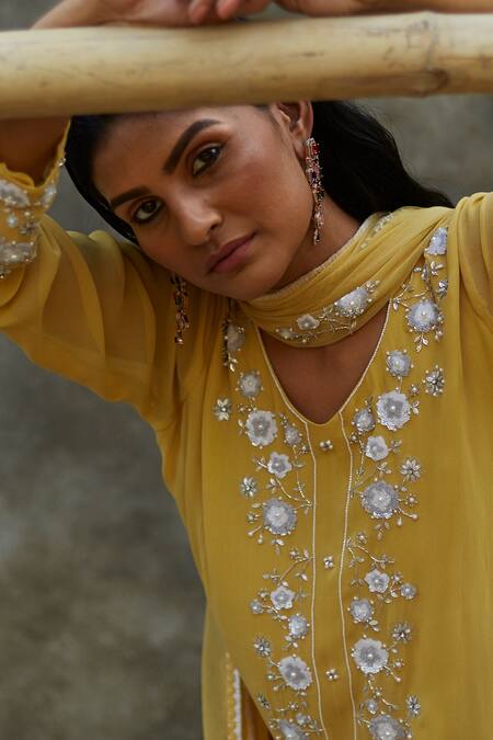 Buy Radha Sharma Yellow Georgette Embroidered Floral Motifs Leaf Neck Kurta Pant Set Online at Aza Fashions Buy_Radha Sharma_Yellow Georgette Embroidered Floral Motifs Leaf Neck Kurta Pant Set _Online_at_Aza_Fashions