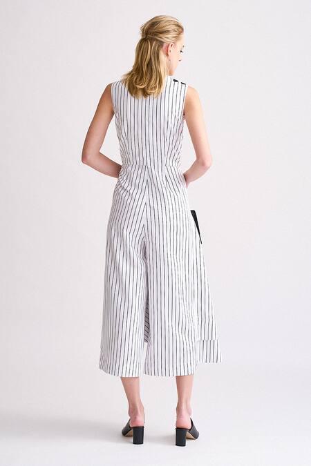 Shop Notebook White Terry Rayon Striped V Neck Pierrie Overlap Jumpsuit at Aza Fashions Shop_Notebook_White Terry Rayon Striped V Neck Pierrie Overlap Jumpsuit_at_Aza_Fashions