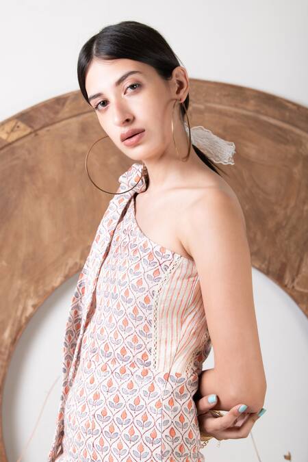 Kalakaari By Sagarika_White Cotton Floral Hand Blocks One Shoulder Print Tie-up Jumpsuit_at_Aza_Fashions