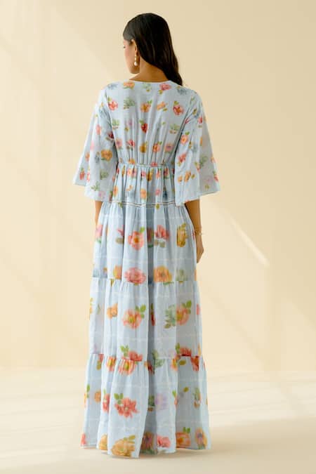 Shop Pozruh By Aiman Blue Hemp Floral V Neck Print Tiered Maxi Dress at Aza Fashions Shop_Pozruh By Aiman_Blue Hemp Floral V Neck Print Tiered Maxi Dress_at_Aza_Fashions