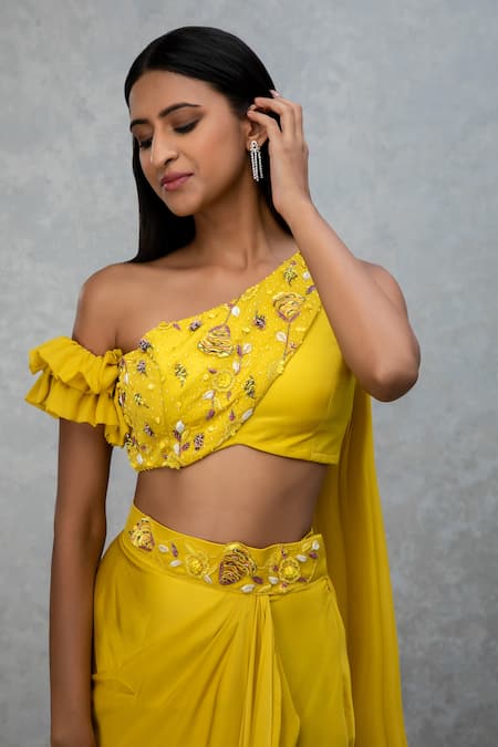 Buy_ISHA GUPTA TAYAL_Yellow Satin Silk Cutdana Work One Shoulder Draped Top And Skirt Set _Online_at_Aza_Fashions