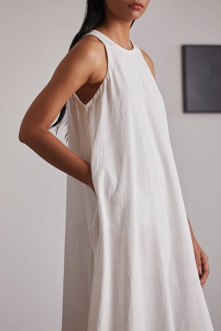 The Summer House White Handspun And Handwoven Cotton Round Neal Ruffle Hem Dress at Aza Fashions The Summer House_White Handspun And Handwoven Cotton Round Neal Ruffle Hem Dress _at_Aza_Fashions