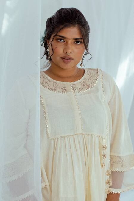 Shop Latha Puttanna White Hand Woven Cotton Floral Motifs Round Kansa Tunic Online at Aza Fashions Shop_Latha Puttanna_White Hand Woven Cotton Floral Motifs Round Kansa Tunic _Online_at_Aza_Fashions