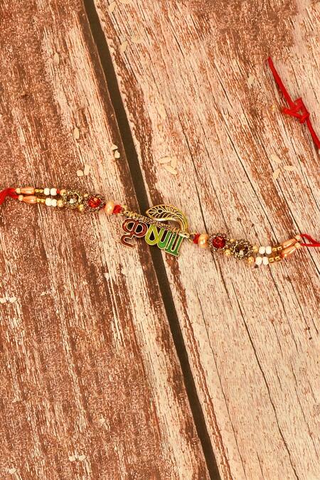 Khwaab By Sanjana Lakhani_Gold Stones Krishna Motif Rakhi_Online_at_Aza_Fashions