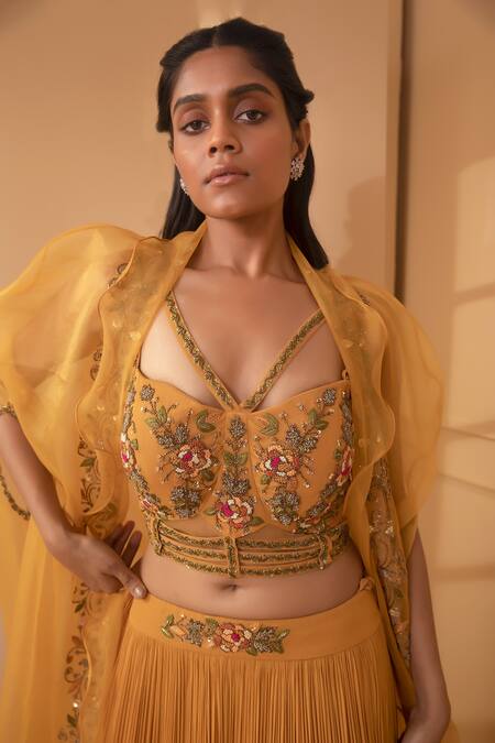 Miku Kumar_Orange Net, Tissue, Georgette Floral Skirt Set With Embroidered Ruffle Cape_at_Aza_Fashions