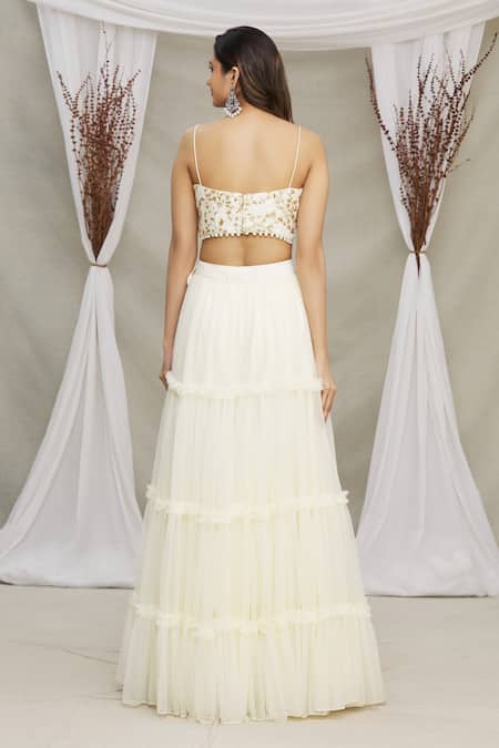 Shop Priti Sahni White Blouse Raw Silk And Lehenga, Dupatta Tulle Tiered Ruffle Skirt Set at Aza Fashions Shop_Priti Sahni_White Blouse Raw Silk And Lehenga, Dupatta Tulle Tiered Ruffle Skirt Set _at_Aza_Fashions