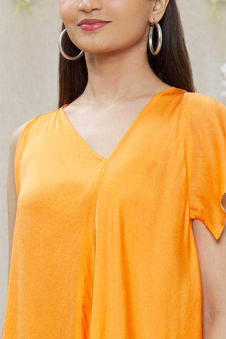 Megha Garg_Orange Crepe Plain Asymmetric Draped Tunic_at_Aza_Fashions