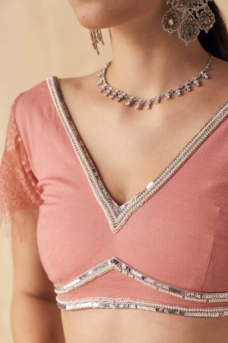 SAKSHI GIRRI_Peach Organza, Cotton Modal Lycra Floral V Neck Pre-draped Saree With Blouse_at_Aza_Fashions