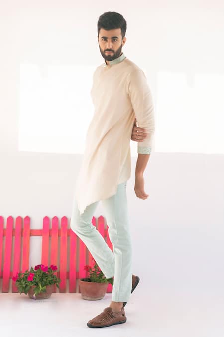 Buy Vaani Beswal Peach Handwoven Cotton Coco Asymmetric Overlap Kurta Online at Aza Fashions Buy_Vaani Beswal_Peach Handwoven Cotton Coco Asymmetric Overlap Kurta _Online_at_Aza_Fashions