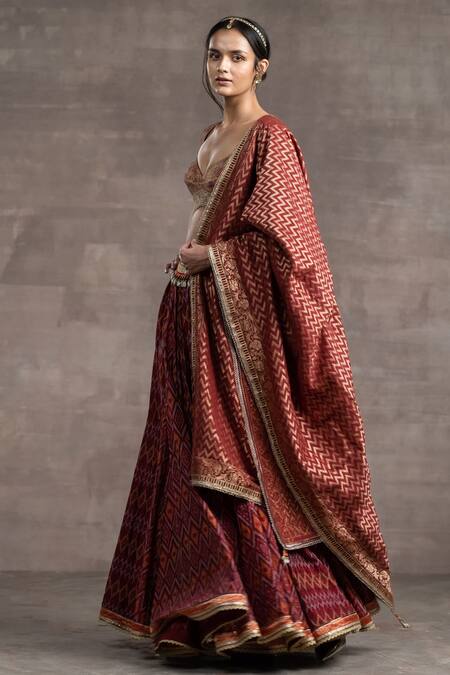 Tarun Tahiliani_Maroon Brocade Chanderi, Ikat Geometric Motifs Plunged V-neck Print Lehenga Set_Online_at_Aza_Fashions